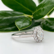14kw gold  1/2 carat Oval diamond halo ring with .30 carat diamond halo
